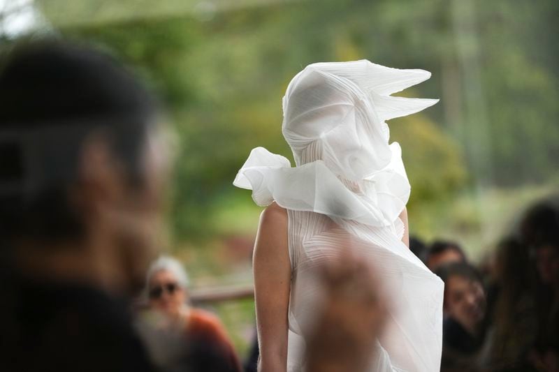 A model wears a creation as part of the Issey Miyake Spring/Summer 2025 collection presented Friday, Sept. 27, 2024 in Paris. (Photo by Scott A Garfitt/Invision/AP)