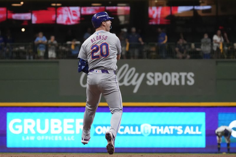 New York Mets' Pete Alonso reacts after hitting a three-run home run during the ninth inning of Game 3 of a National League wild card baseball game against the Milwaukee Brewers Thursday, Oct. 3, 2024, in Milwaukee. (AP Photo/Morry Gash)