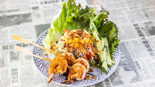 Hawkers Asian Street Food’s Green Papaya Salad with Grilled Shrimp Skewers. (Courtesy of Hawkers Asian Street Food)