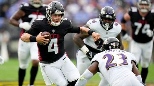 Atlanta Falcons quarterback Taylor Heinicke is tackled by Baltimore Ravens linebacker Trenton Simpson during the first half of a preseason NFL football game on Saturday, Aug. 17, 2024, in Baltimore. (AP Photo/Stephanie Scarbrough)