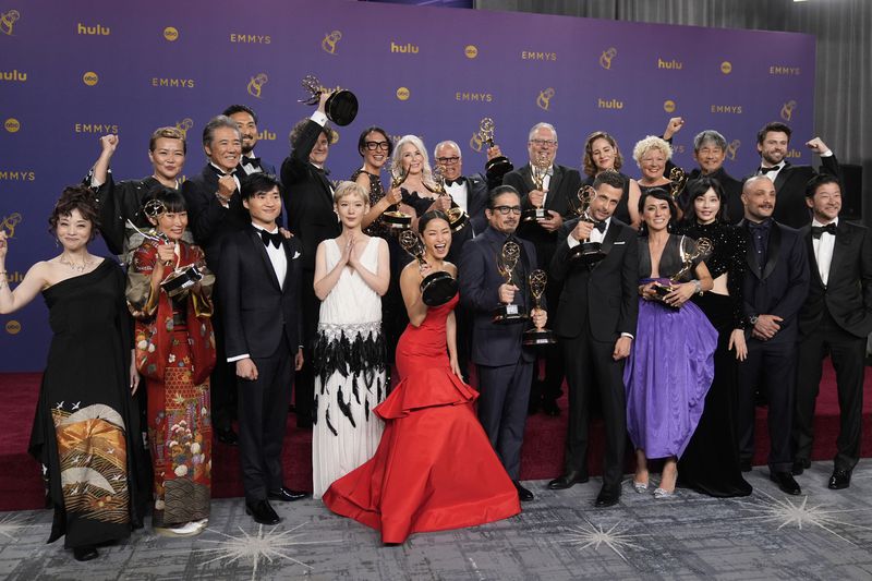 Hiroyuki Sanada, center, winner of the award for outstanding lead actor in a drama series for "Shogun" poses in the press room with the team from "Shogun", winners for award for for outstanding drama series, during the 76th Primetime Emmy Awards on Sunday, Sept. 15, 2024, at the Peacock Theater in Los Angeles. (AP Photo/Jae C. Hong)