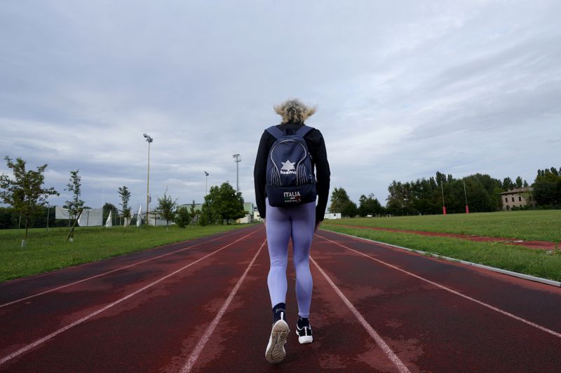 Italy's Valentina Petrillo walks before training in Pieve di Cento, near Bologna, Italy, Monday, Aug. 19, 2024. Valentina Petrillo is set to become the first transgender woman to compete at the Paralympic Games at the end of this month in Paris. (AP Photo/Antonio Calanni)