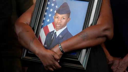 FILE - Chantemekki Fortson, mother of slain Roger Fortson, a U.S. Air Force senior airman, holds a photo of her son during a news conference with attorney Ben Crump on Monday, June 3, 2024, in Atlanta. (AP Photo/Brynn Anderson, File)