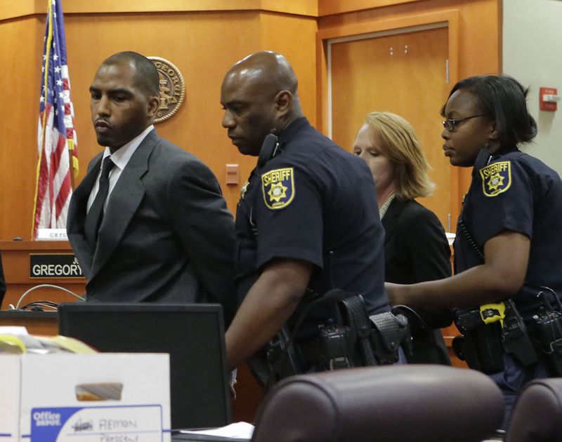 Aeman Presley is taken into custody on June 13, 2015 following his guilty plea in DeKalb County Court to the deaths of two homeless men in 2014, and the murder of a woman he robbed. (Bob Andres / bandres@ajc.com)