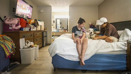 Melissa Bullard (right) with her daughter Heaven and their dog in the bed at the Days Inn in Brunswick, Georgia, Friday, Sept. 6, 2024. (Photo Courtesy of Justin Taylor/The Current GA)