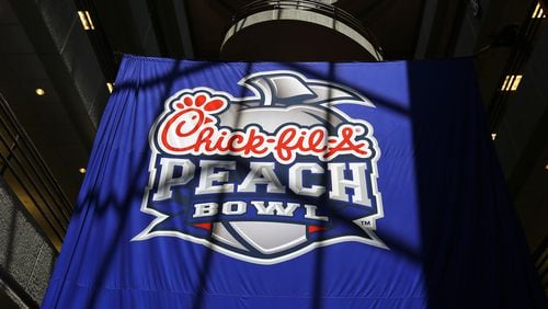 042114 ATLANTA: The new Chick-fil-A Peach Bowl logo hangs in the Chick-fil-A corporate headquarters after an unveiling ceremony on Monday, April 21, 2014, in Atlanta.       CURTIS COMPTON / CCOMPTON@AJC.COM
