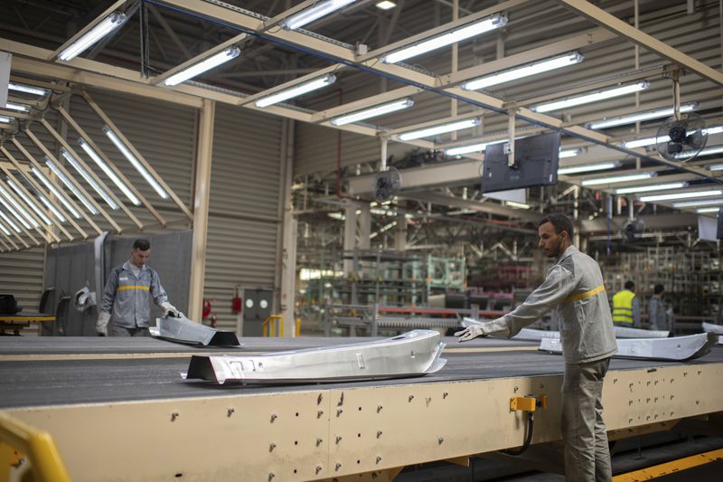 FILE - Workers assemble vehicle parts on a production line inside Renault factory, on the outskirts of Tangier, Morocco, April 29, 2024. Investment in electric vehicle manufacturing is booming in Morocco, a country that neighbors Europe and enjoys a free trade agreement with the United States. (AP Photo, File)