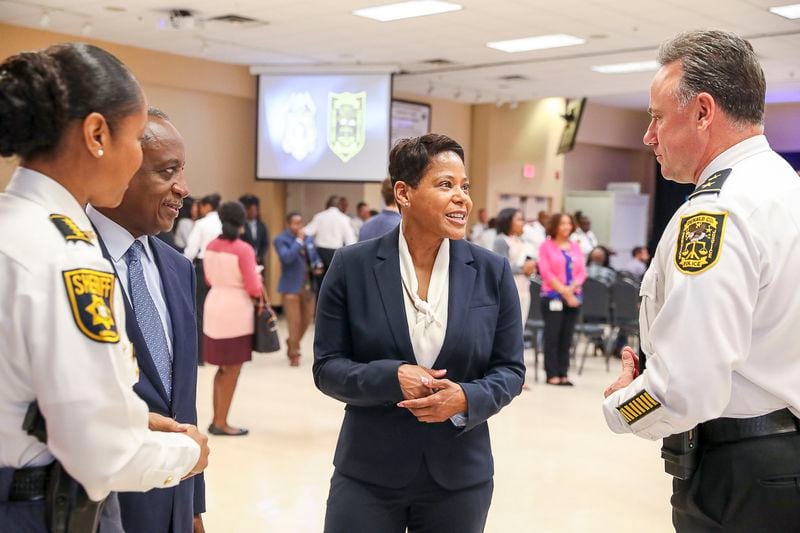 Ramos (center) introduces herself to members of DeKalb County's law enforcement before a press conference Monday. (Alyssa Pointer/Atlanta Journal Constitution)