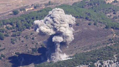 Smoke rises from an Israeli airstrike on the Mahmoudieh mountain, as seen from Marjayoun town, south Lebanon, Tuesday, Sept. 24, 2024. (AP Photo/Hussein Malla)