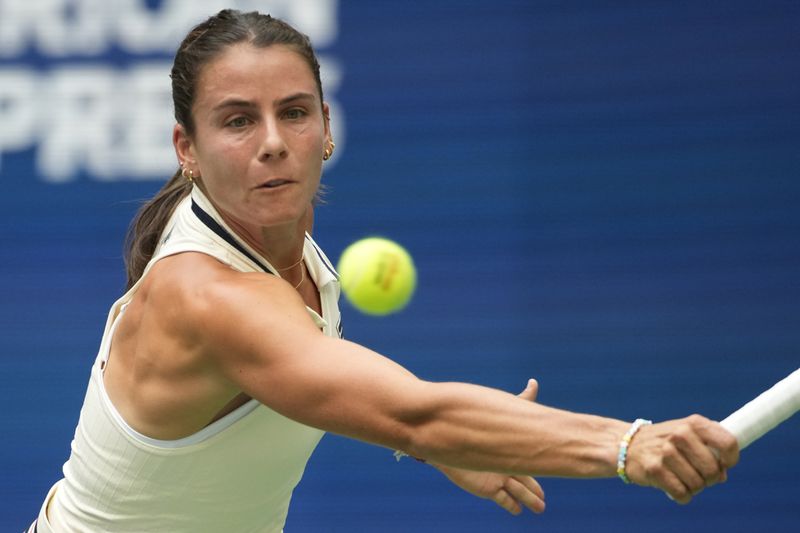 Emma Navarro, of the United States, returns a shot to Coco Gauff, of the United States, during the fourth round of the U.S. Open tennis championships, Sunday, Sept. 1, in New York. 2024. (AP Photo/Pamela Smith)