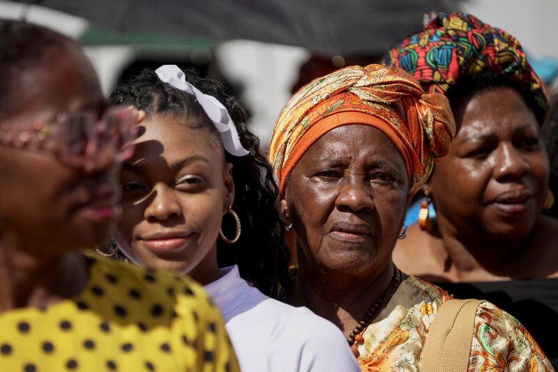 Women line up to attend a forum on Afro women and power with Prince Harry and his wife Meghan in Cali, Colombia, Sunday, Aug. 18, 2024. (AP Photo/Ivan Valencia)