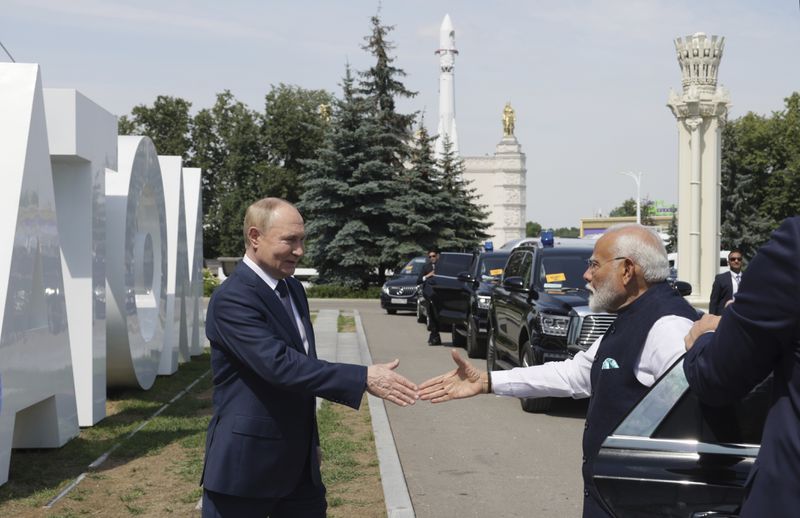 Russian President Vladimir Putin, left, and Indian Prime Minister Narendra Modi visit Atom pavilion at the Exhibition of Achievements of National Economy (VDNKh) in Moscow, Russia, Tuesday, July 9, 2024. (Gavriil Grigorov, Sputnik, Kremlin Pool Photo via AP)