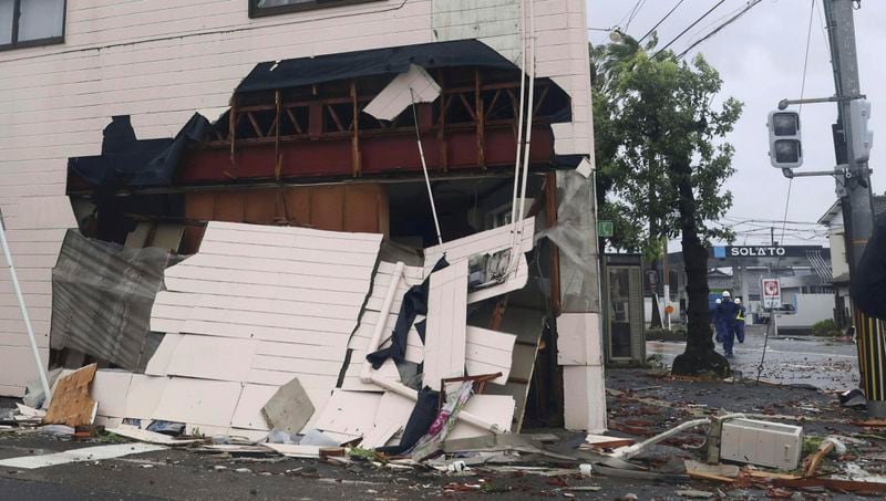 An exterior wall of a building is seen damaged by strong wind of a typhoon in Miyazaki, western Japan, Thursday, Aug. 29, 2024. (Kyodo News via AP)