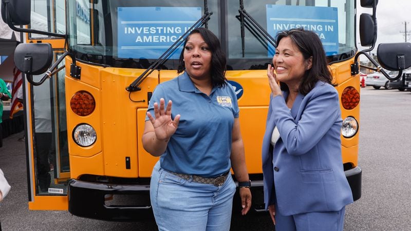 (Left to right) Bluebird employee Delushundra Thomas and acting Secretary of Labor Julie Su chat following an event at the Blue Bird bus plant in Fort Valley on Friday, July 19, 2024. The Biden-Harris administration plans to expand jobs with a grant of $80 million to Blue Bird to build a new factory that will produce electric buses.  (Natrice Miller/ AJC)
 