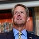 Gov. Brian Kemp listens to his alma mater UGA’s fight song during a press conference at Google Atlanta on Wednesday, July 27, 2022. (Natrice Miller/natrice.miller@ajc.com)