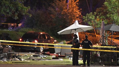 Police are shown at the scene where a car drove into the patio seating area of Park Tavern in St. Louis Park, Minn., Sunday night, Sept. 1, 2024. (Jeff Wheeler/Star Tribune via AP)