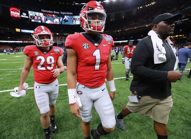 Ehlinger runs for 3 scores as Texas shocks Georgia in Sugar Bowl