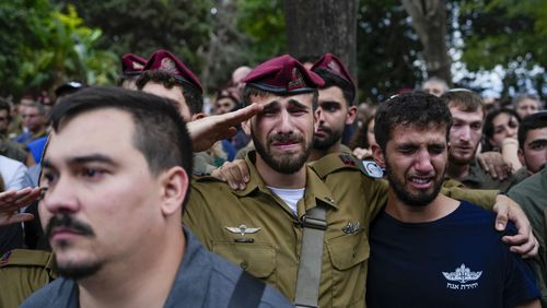 Mourners attend the funeral of Sgt. First Class Nazar Itkin who was killed during Israel's ground operation against Hezbollah militants in Lebanon, in Kiryat Ata, Israel, Sunday, Oct. 6, 2024. (AP Photo/Baz Ratner)