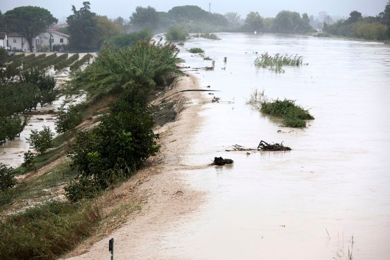 The Lamone river overflows its banks near Bagnacavallo, in the region of Emilia-Romagna, Italy, Thursday, Sept. 19, 2024. (Fabrizio Zani/LaPresse via AP)