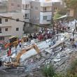 FILE - People and rescue teams search for victims after an Israeli airstrike hit two adjacent buildings, in Ain el-Delb neighbourhood east of the southern port city of Sidon, Lebanon, Sunday, Sept. 29, 2024. (AP Photo/Mohammed Zaatari, File)