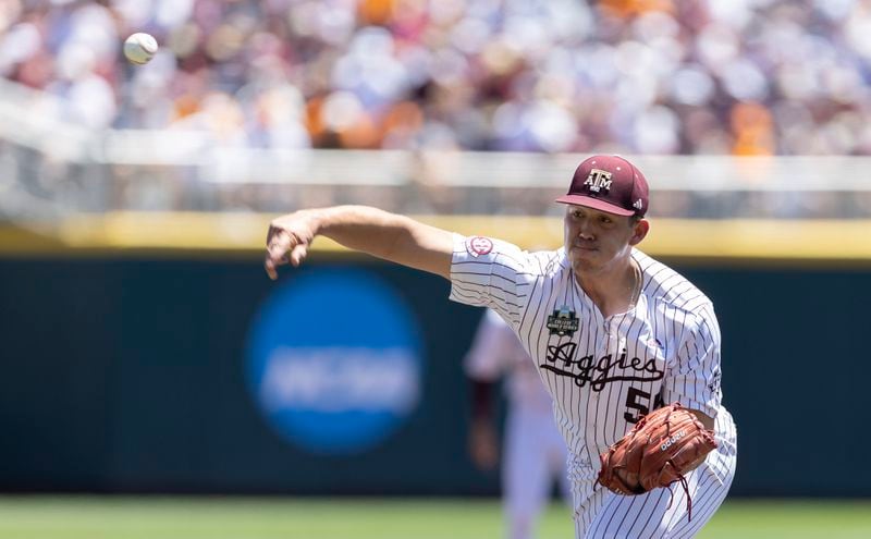Texas A&M starting pitcher Zane Badmaev throws against Tennessee in the first inning of Game 2 of the NCAA College World Series baseball finals in Omaha, Neb., Sunday, June 23, 2024. (AP Photo/Rebecca S. Gratz)