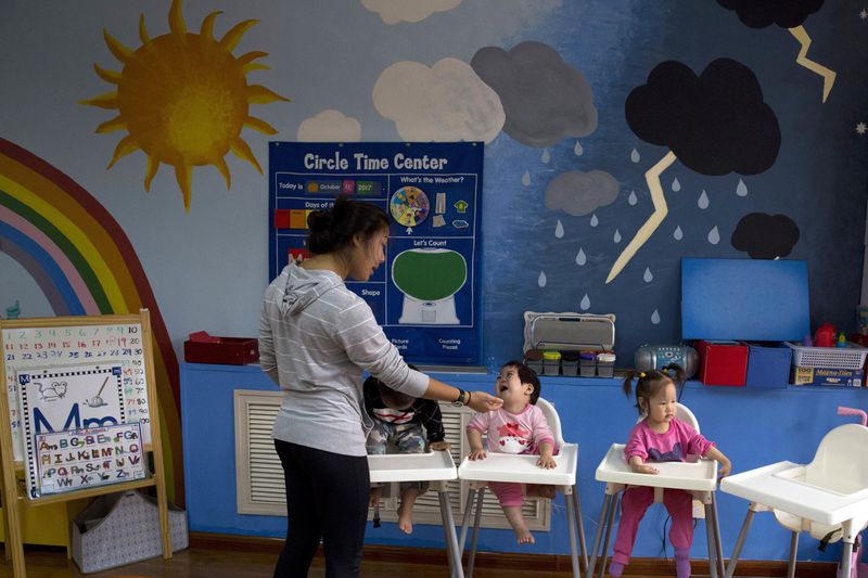 FILE - Children attend classes at a foster home of the New Hope Foundation on the outskirts of Beijing, China on Oct. 11, 2017. (AP Photo/Ng Han Guan, File)