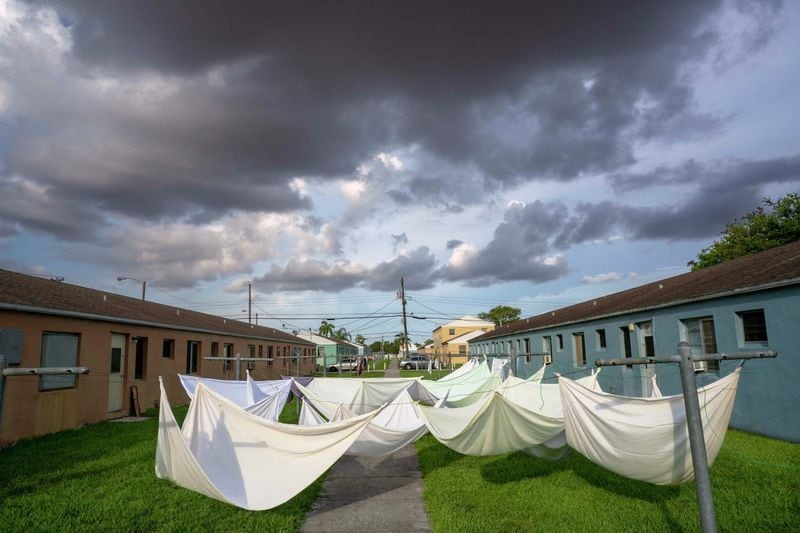 Laundry hangs in a courtyard in the Liberty housing project in Miami, the setting for the independent film “Liberty.” CONTRIBUTED: ALEX HARRIS