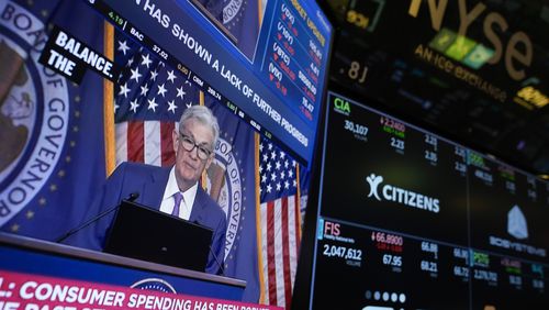 A screen displays a news conference with Federal Reserve Chairman Jerome Powell on the floor at the New York Stock Exchange in May. The Fed's rate-setting committee meets this week. (AP Photo/Seth Wenig, File)