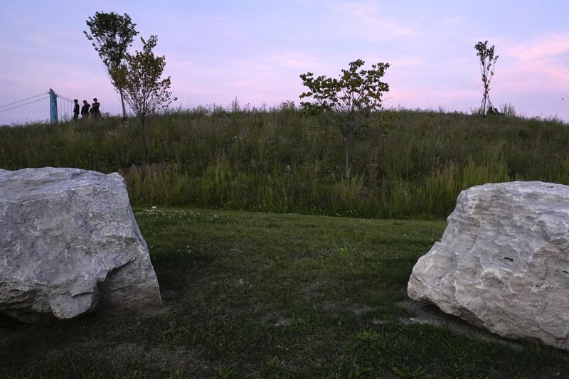 A meadow is visible at Riverside Park in Detroit, Tuesday, Sept. 10, 2024. (AP Photo/Paul Sancya)