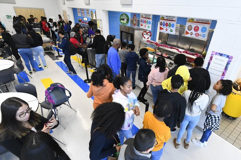 Students line up for lunch in the cafeteria at Elite Scholars Academy in Jonesboro on Jan. 17, 2020. Meals are free for all students in the Clayton County schools. 