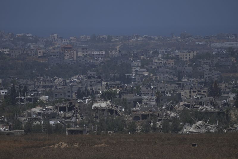 Destroyed buildings in the Gaza Strip, as seen from southern Israel, Friday, May 24, 2024. (AP Photo/Tsafrir Abayov)