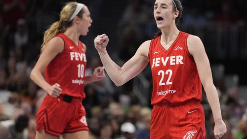 Indiana Fever guard Caitlin Clark (22) reacts after the team scores in the second half of an WNBA basketball game against the Atlanta Dream, Monday, Aug. 26, 2024, in Atlanta. (AP Photo/Brynn Anderson)