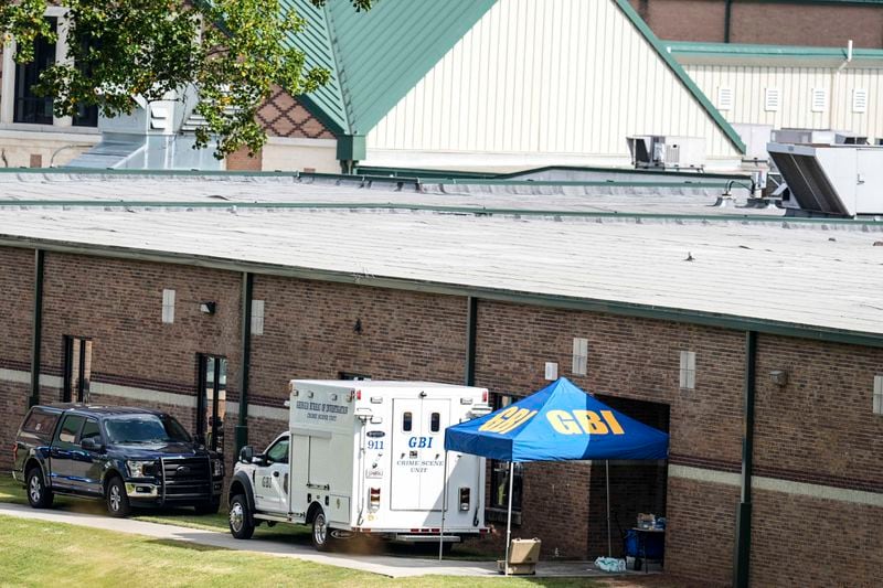 Georgia Bureau of Investigation staff move through an entrance to Apalachee High School after Wednesday's multiple shooting, Thursday, Sept. 5, 2024, in Winder, Ga. (AP Photo/Mike Stewart)WLD