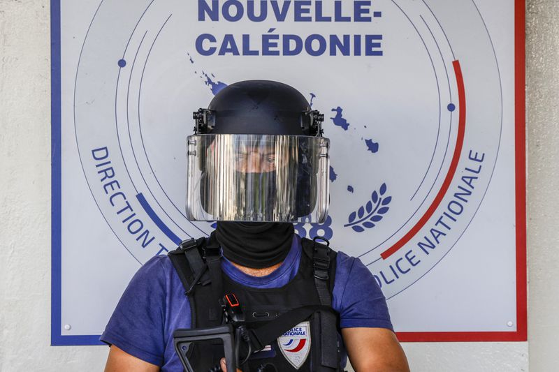 A policeman waits for the arrival of French President Emmanuel Macron at the central police station in Noumea, New Caledonia, Thursday, May 23, 2024. Macron has met with local officials in riot-hit New Caledonia, after crossing the globe in a high-profile show of support for the French Pacific archipelago gripped by deadly unrest.(Ludovic Marin/Pool Photo via AP)