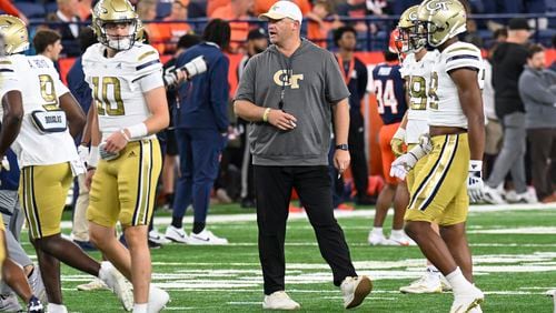 Georgia Tech head coach Brent Key instructs his players during the first half of an NCAA football game against Syracuse, Saturday, Sept. 7, 2024 in Syracuse, N.Y. (AP Photo/Hans Pennink)