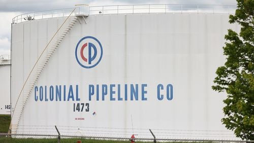 Fuel holding tanks are seen at Colonial Pipeline's Linden Junction Tank Farm on Monday, May 10, 2021, in Woodbridge, New Jersey. Alpharetta, Georgia-based Colonial Pipeline, which has the largest fuel pipeline, was forced to shut down its oil and gas pipeline system on Friday after a ransomware attack that has slowed down the transportation of oil in the eastern U.S. (Michael M. Santiago/Getty Images/TNS)