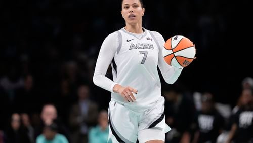 Las Vegas Aces' Alysha Clark (7) looks to pass during the second half of a WNBA basketball semifinal game against the New York Liberty, Tuesday, Oct. 1, 2024, in New York. The Liberty won 88-84. (AP Photo/Frank Franklin II)