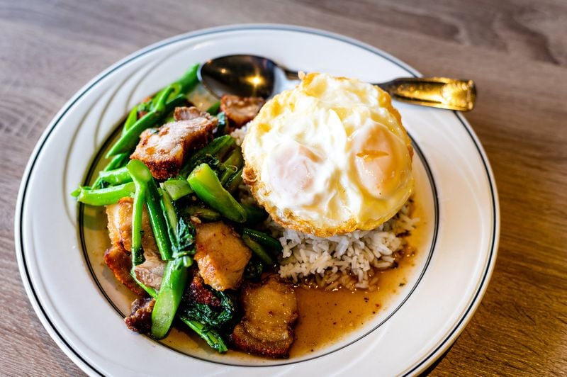 One of Thaicoon & Sushi Bar’s brunch options is Kana Moo Krob, fried kale with crispy pork and rice. CONTRIBUTED BY HENRI HOLLIS