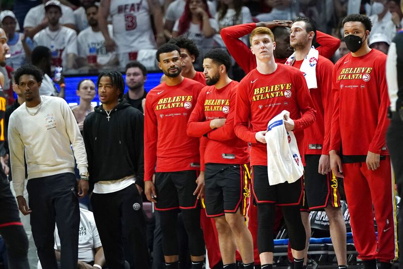 Atlanta Hawks guard Kevin Huerter, second from right, during the second half of Game 2 of an NBA basketball first-round playoff series, Tuesday, April 19, 2022, in Miami. The Heat won 115-105. (AP Photo/Lynne Sladky)