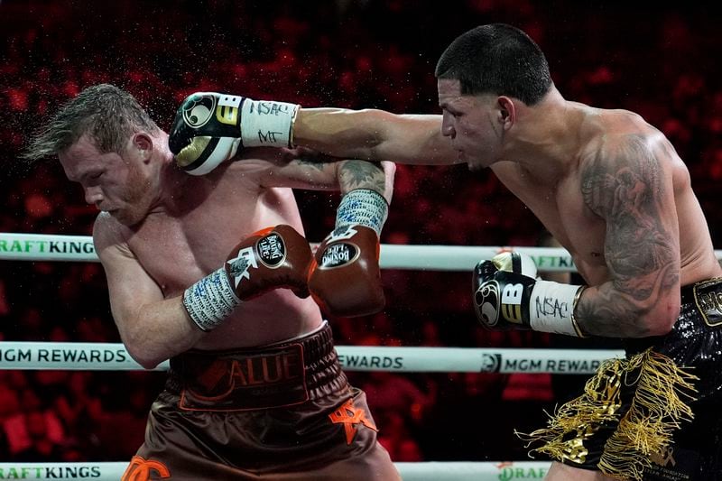 Edgar Berlanga hits Canelo Alvarez in a super middleweight title bout Saturday, Sept. 14, 2024, in Las Vegas. (AP Photo/John Locher)