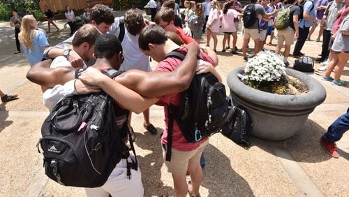 GATHERING IN HONOR--April 28, 2016 Athens - Students gather to mourn the deaths of fellow UGA students at a memorial organized by The Field at Tate Plaza on campus on Thursday, April 28, 2016. Just days before the end of the school year, tragedy struck the University of Georgia community. A two-vehicle crash Wednesday night killed four students and left a fifth in critical condition. HYOSUB SHIN / HSHIN@AJC.COM