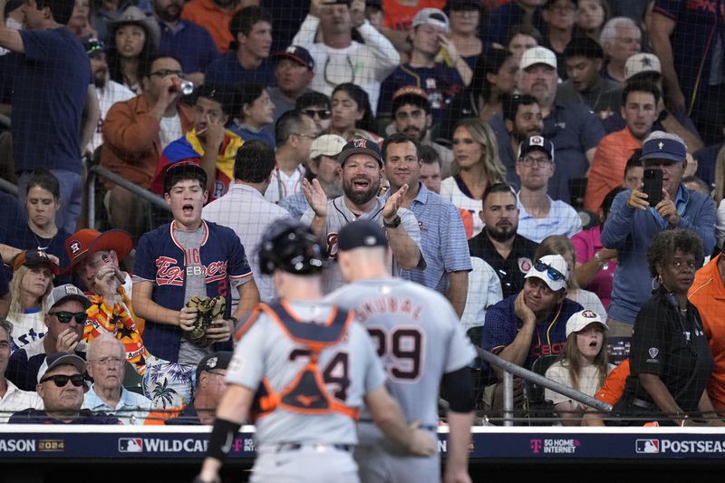 Detroit Tigers fans cheer starting pitcher Tarik Skubal (29) after the fourth inning of Game 1 of an AL Wild Card Series baseball game against the Houston Astros, Tuesday, Oct. 1, 2024, in Houston. (AP Photo/Kevin M. Cox)