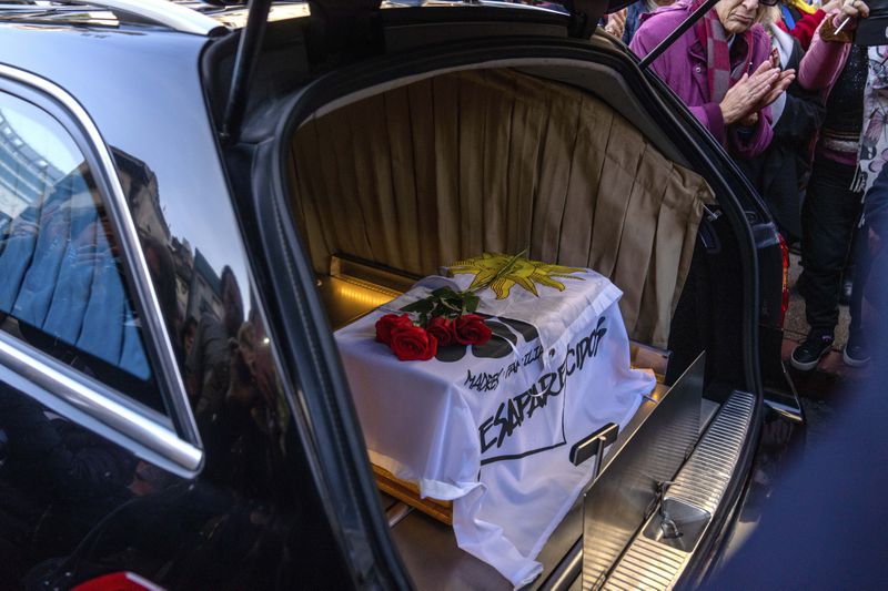 The coffin that contains the remains of Amelia Sanjurjo sits inside a hearse during her funeral service at the University of the Republic, in Montevideo, Uruguay, Thursday, June 6, 2024. The Uruguayan Prosecutor’s Office confirmed that the human remains found in June 2023 at the 14th Battalion of the Uruguayan Army belong to Sanjurjo, a victim of the 1973-1985 dictatorship who was 41 years old and pregnant at the time of her disappearance. (AP Photo/Matilde Campodonico)