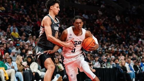 Cody Williams of Team USA (R) dribbles past Zaccharie Risacher of World Team (L) during the Nike Hoop Summit at the Moda Center on Saturday, April 8, 2023 in Portland, Ore. The USA Team went on to win 90-84 over the World Team. (Photo by Ali Gradischer for The Oregonian/OregonLive)