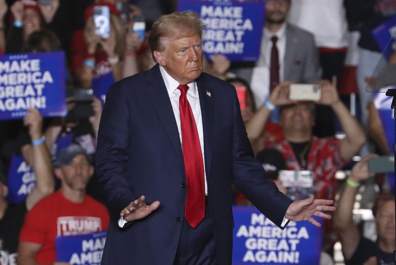 Republican presidential nominee former President Donald Trump dances at a campaign rally at Bayfront Convention Center in Erie, Pa., Sunday, Sept. 29, 2024. (AP Photo/Rebecca Droke)