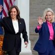 Democratic presidential nominee Vice President Kamala Harris walks with former Rep. Liz Cheney, R-Wyo., at a campaign rally at Ripon College, Thursday, Oct. 3, 2024, in Ripon, Wis. (AP Photo/Charlie Neibergall)