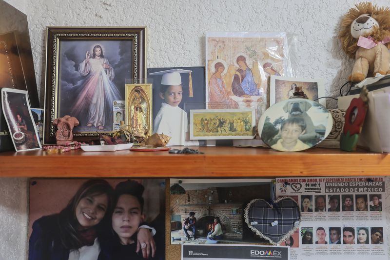 Childhood photos of Diego Maximiliano stand with religious images in his mother's office at her home in Ecatepec, Mexico, Friday, Aug. 2, 2024. Diego went missing when he was 16 years old on Sept. 4, 2015. (AP Photo/Ginnette Riquelme)