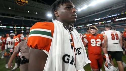 Miami quarterback Cam Ward walks off the field after an NCAA football game against Florida A&M, Saturday, Sept. 7, 2024, in Miami Gardens, Fla. (AP Photo/Lynne Sladky)