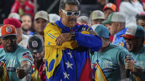 President Nicolas Maduro addresses supporters outside Miraflores presidential palace after electoral authorities declared him the winner of the presidential election in Caracas, Venezuela, Monday, July 29, 2024. (AP Photo/Fernando Vergara)