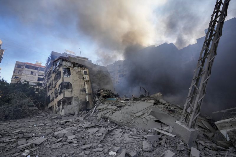 Smoke rises from the site of an Israeli airstrike in Dahiyeh, Beirut, Lebanon, Thursday, Oct. 3, 2024. (AP Photo/Hassan Ammar)